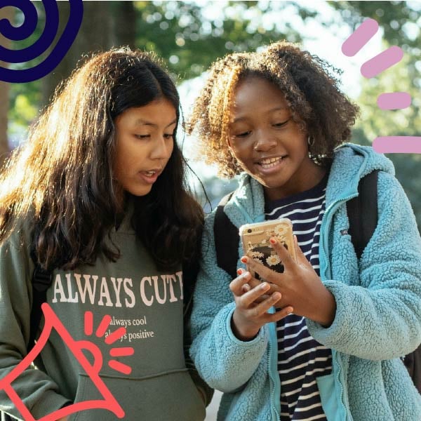 Girls looking at iphone